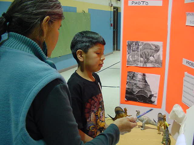 Troy and science fair judge at his spinosaurus display